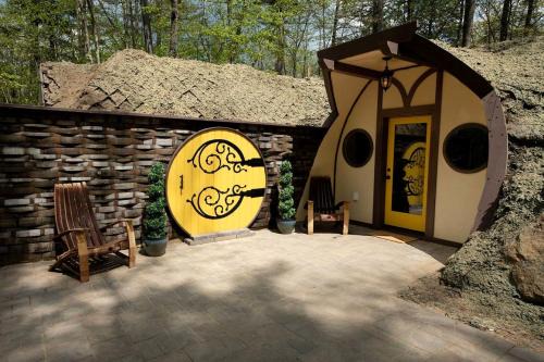 Springvale House | Charming Luxury Hobbit House with Private Hot Tub in Tranquil Woodlands on Littlefield Pond in Springvale, Maine