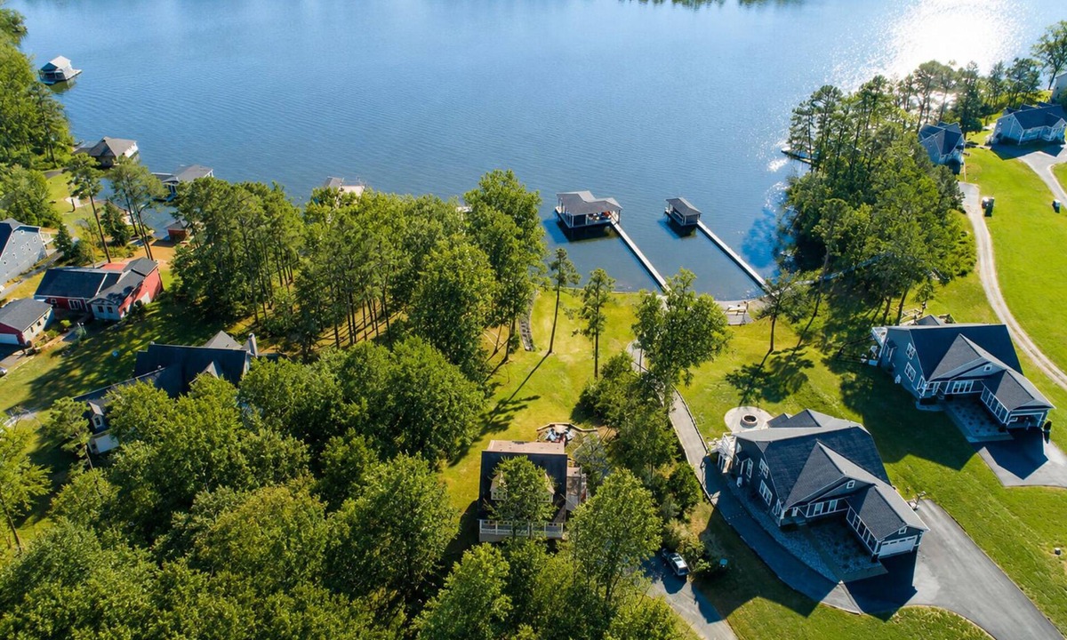 Orange House | Lakeside retreat with a firepit, dock, deck, hot tub, pool table - dog friendly