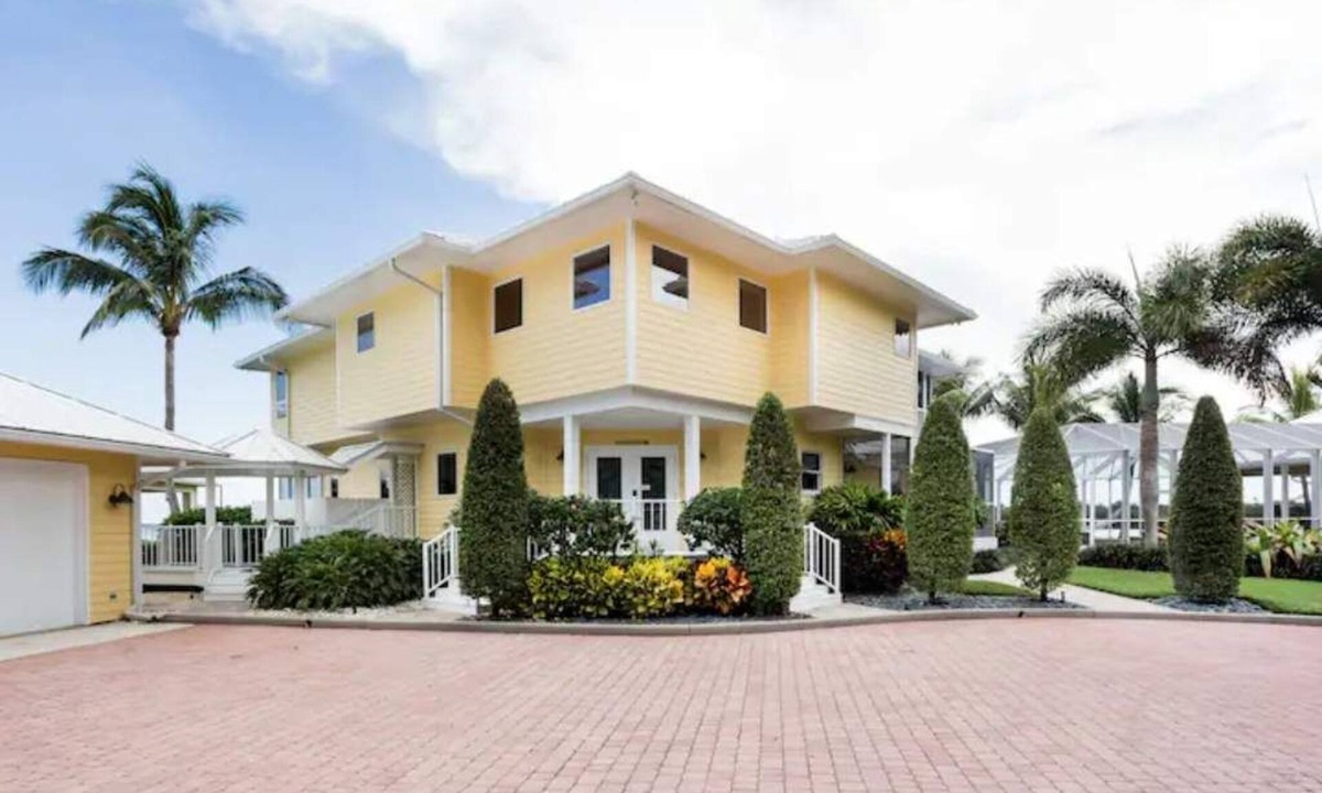Port Saint Lucie House | Lush Waterfront Pool Home and Pool house with Pickleball court and Boat dock