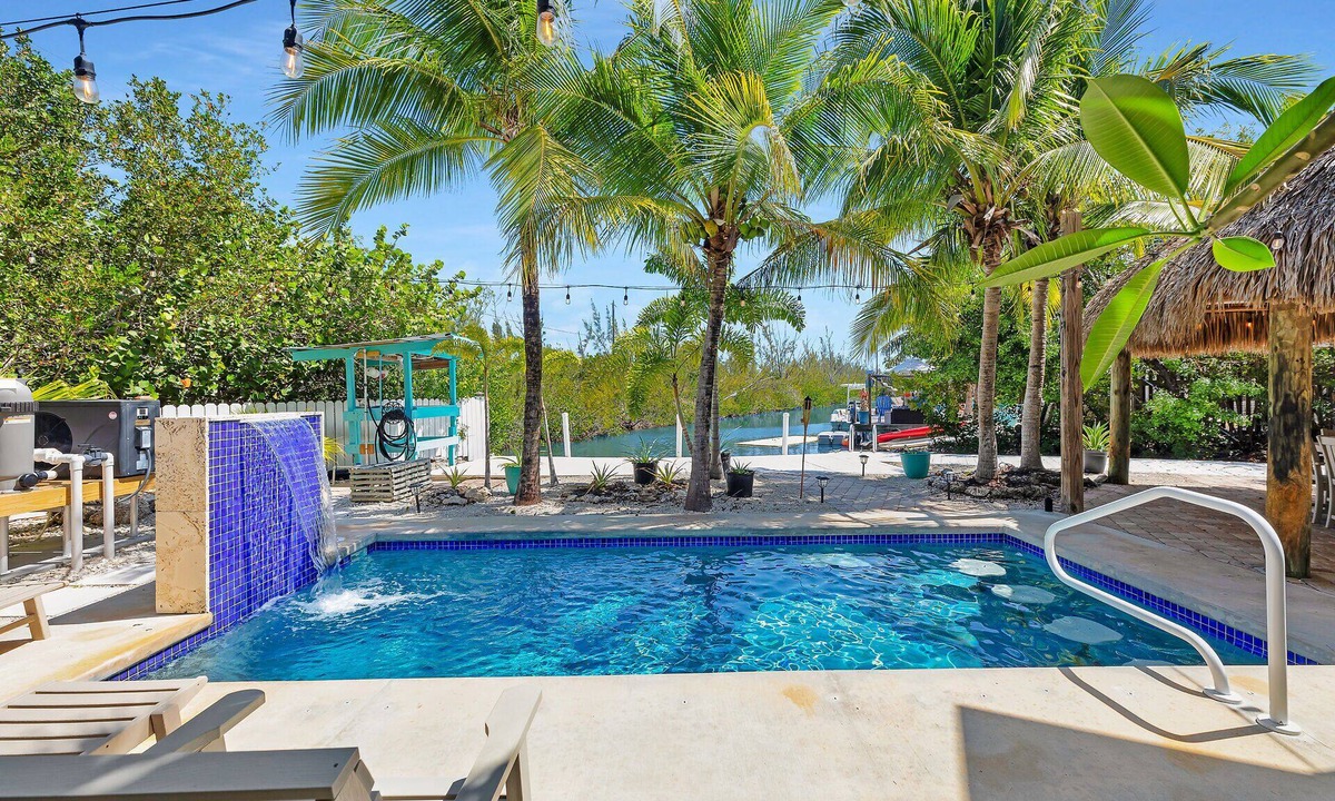 Sugarloaf Shores House | Tropical paradise on canal in Lower Keys-pool, tiki, firepit, dock, dog friendly
