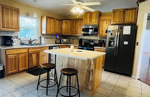 Cocoa House | 3-bedroom house in peaceful Cocoa with cool AC and pretty poolside views