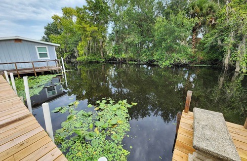 Astor House | Astor Serene Riverfront Retreat with 2 boat slips and a dock