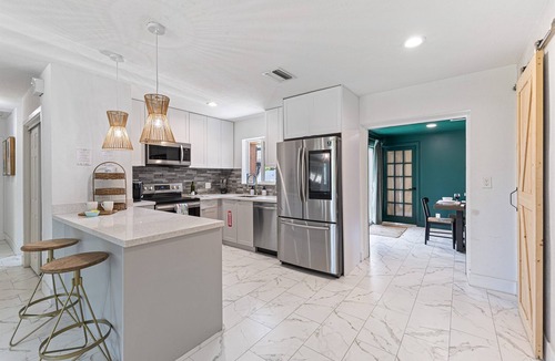 Oakland Park House | Backyard Paradise: Gazebo, Outdoor TV, Grill, Sandpit – Perfect Getaway