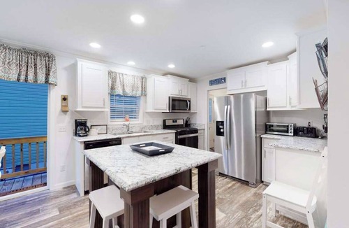 Montego Bay House | Beachy bayside home in quiet neighborhood with patio, central AC, pool, & tennis