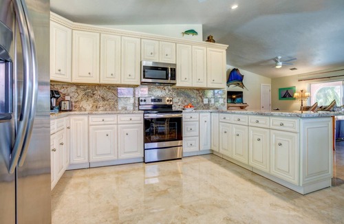 Cudjoe Key House | Casa Rosada: Cudjoe Gardens Canal Front Retreat, Pool, Tiki, Deep Dockage & Rapid Open Water Access!