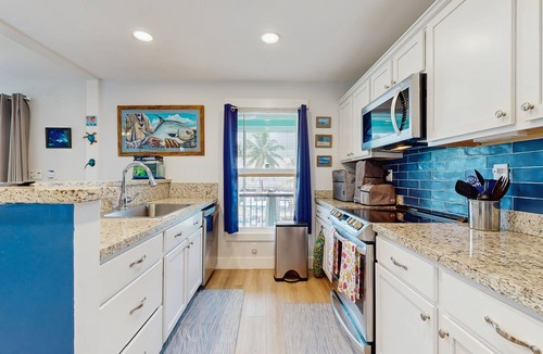 Eden Pines House | Coastal canalfront home with swim spa, dock, kayaks, e-bikes & dog friendly