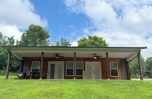 Bellefonte House | Cozy creekside bungalow that sleeps 8. Listen to the creek as you fall asleep