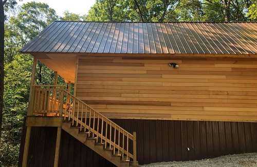 Winslow Cabin | Cozy tiny cabin nestled in a little woodland village – playground, pond and more
