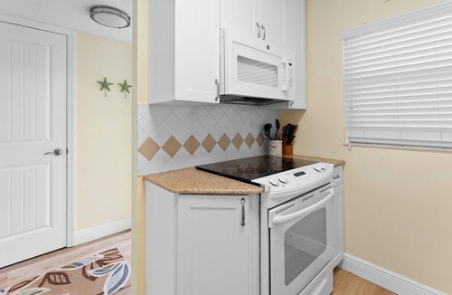 New Smyrna Beach Condo | Direct oceanfront 2/2 with a private balcony, heated pool, and beach access