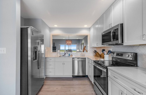 Ocean View House | Fantastic Bethany Bay gem with shared pool, screened porch, bay views & WiFi