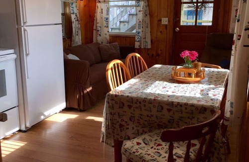 Hampton Cottage | Immaculate Cottage with flower-lined deck located in Island Area! Pet Friendly!
