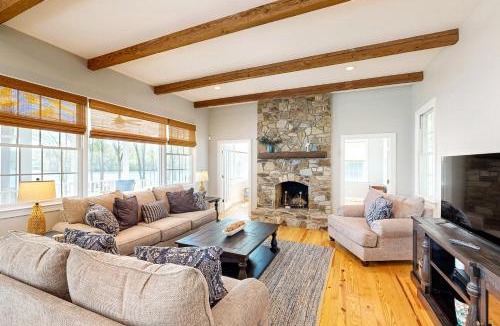 Mineral House | Lakefront home with private dock, kayaks, beach, badminton, firepit, & deck