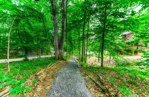 Blue Water House | Lakeside log home with a private deck, WiFi, firepit, central AC, & washer/dryer