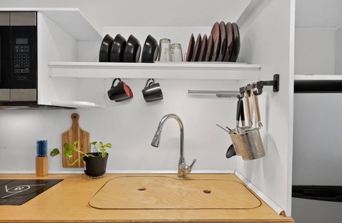 Midway Apartment | Peaceful Lakefront Getaway with Hot Tub & Kayaks