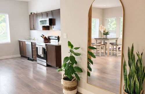 Otter Point Apartment | Private creekside retreat with sauna, fire pit & rain shower.