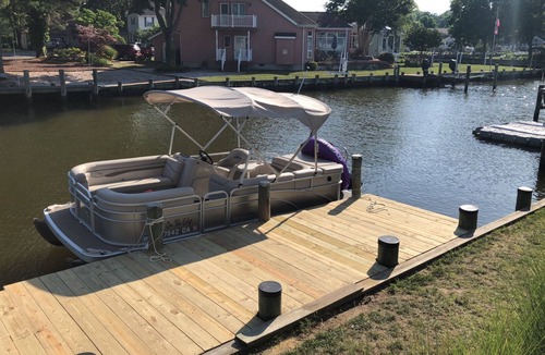 Ocean Pines Cottage | Pura Vida.Canal front beach cottage with private dock and sleeps 8