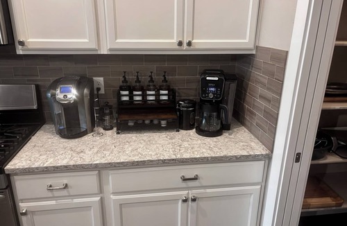 Northwest Boise City House | Relax and recharge at this luxury Boise retreat featuring a private hot tub, sauna, fire pit, game room, and Peloton. Perfect for families, groups, and weekend getaways, this spacious 4-bedroom home comfortably sleeps 9 and is conveniently located.