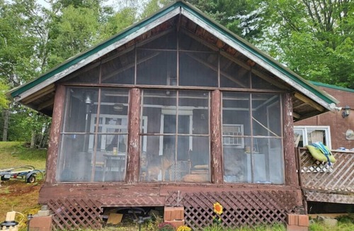 Baileyville Cabin | Relaxing rustic cabin on the lake 25 feet from the shore.