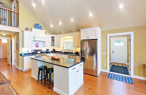 Lamoine Beach House | Renovated waterfront cottage with expansive deck, multiple fireplaces, & grill