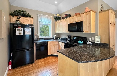 Wells Condo | Seaglass Village Unit 182: 2BR in Wells, featuring a King bed and bunk beds for 4 guests.