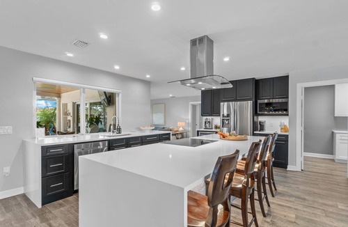 Singer Island Villa | Seven Palms Waterfront - Private Dock, Heated Pool & Lanai - Walk to Beach!