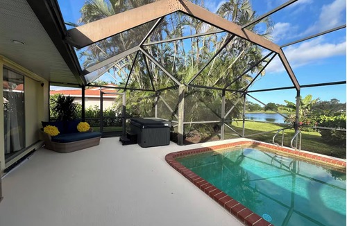 Port Saint Lucie House | Spacious 4BR Lakefront Getaway – Heated Pool, Hot Tub Near Everything!