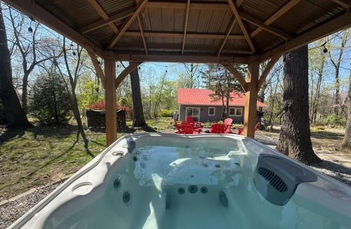 Millville House | Spacious cabin w private river, hot tub & fire pit