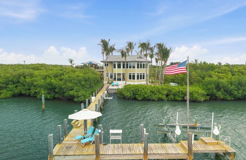 Wabasso Beach House | Stunning Riverfront Home with Private Beach and Close to the Ocean.