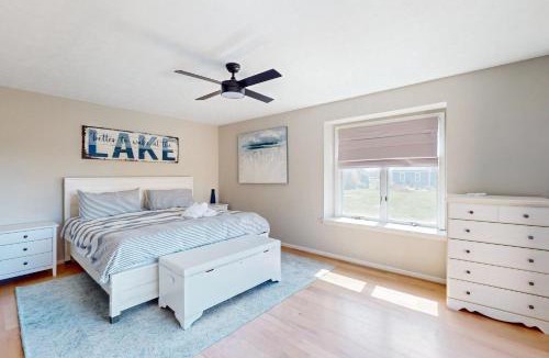 Livingston House | Updated lakefront home & studio with water views, hot tub, dock & game room