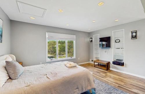Livingston House | Updated lakefront home & studio with water views, hot tub, dock & game room