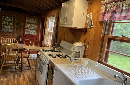 Melvin Village Cottage | Waterfront Lake Winnipesaukee cabins on private sandy beach with dock
