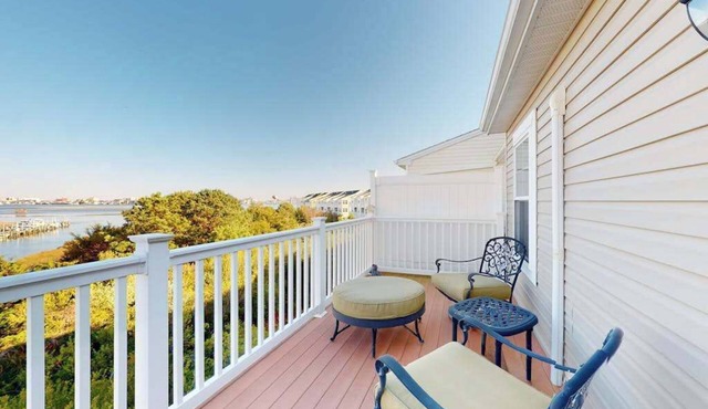 Bay-view townhome with pool & private outdoor living - walk to dining