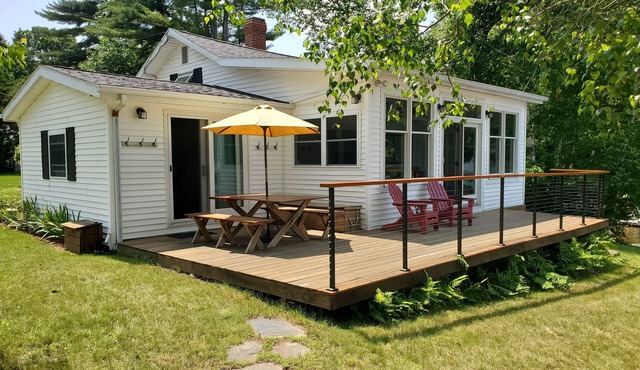 Beautifully landscaped home on Panther Pond just 20 feet from the shore!