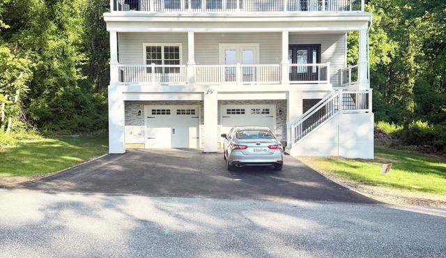 BRAND NEW HOME with amazing roof top, 2 front patios, and rear "forest" patio.