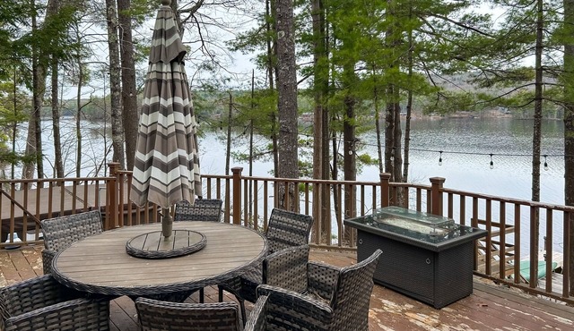 Central lakefront house with private hot tub, dock, patio bar, & beach access