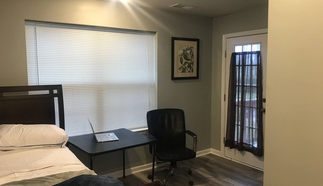 Comfy bedroom with exclusive full bath, patio and private entrance