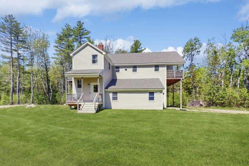 Modern farmhouse with deck, firepit, & balcony