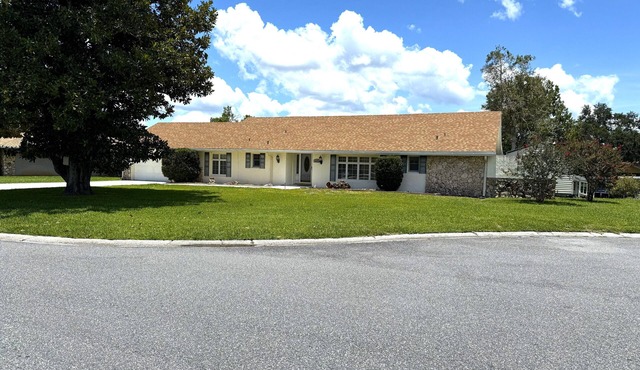 On Lake with boat dock screened patio and BarBQ,recreation bar and pool table.