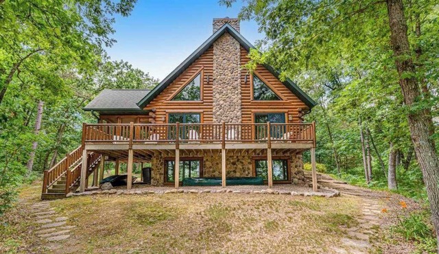 Riverfront cabin with a dock, kayaks and a canoe - firepit and water views
