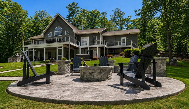 Sprawling waterfront home with kayaks, game room, and hot tub