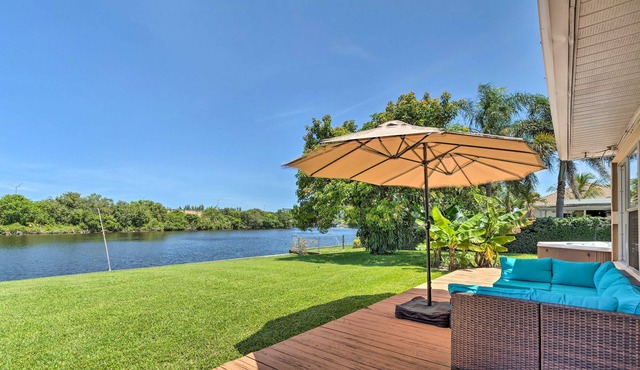 Water-view home near the beach with private hot tub, deck, boat access, grill
